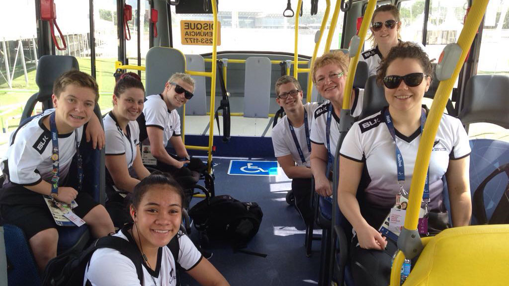 Rebecca in a bus with her swim team mates